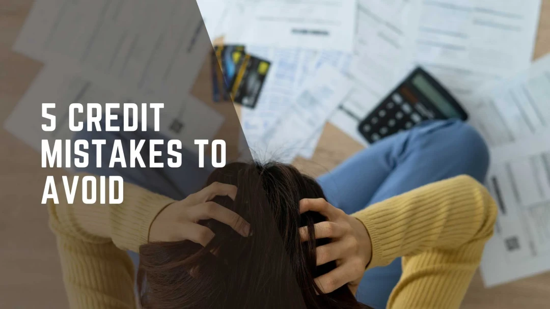 Bank Local. 5 Credit Mistakes to Avoid. Picture of a women sitting down with her head in her hands with credit cards and credit card statements in front of her. 